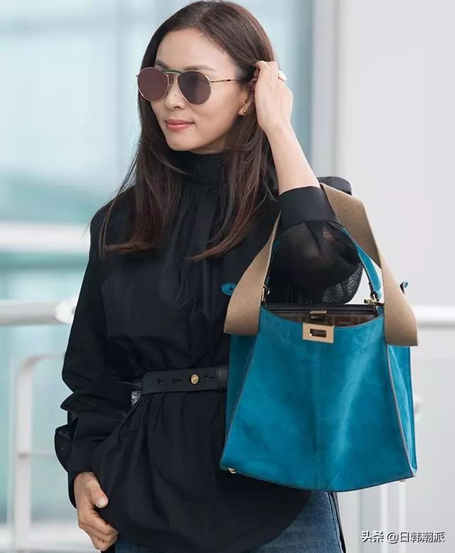 演员张东健妻子高小英时尚机场秀,加上墨镜,增添了帅气的魅力
