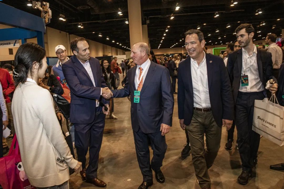 Greg Abel, center, greets attendees during the Berkshire Hathaway annual shareholders meeting in Omaha, Nebraska, in 2023.
