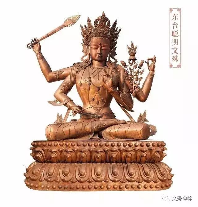 东台聪明文殊 亦称红黄文殊,也叫四臂文殊,身呈红黄色或者红色,右边