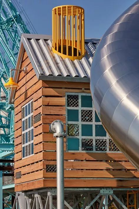 towering,chattanooga domino park includes an elevated cabin, towering silo and an