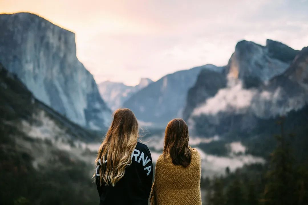 two women facing backwards