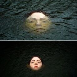 【欧浪】西班牙河中出现“溺水少女”大脸 创意雕塑吓坏当地民众