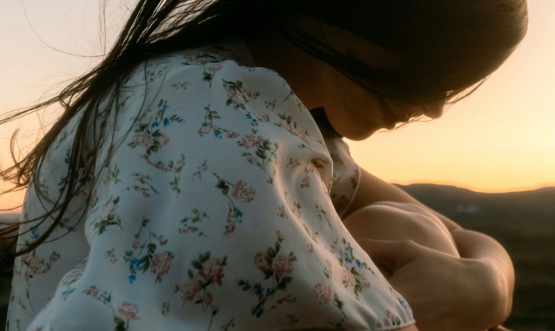 A woman with her hair blowing in the wind