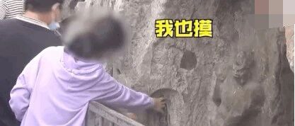 无语！洛阳龙门石窟一尊千年佛像被游客摸出“包浆”！护栏都拦不住......