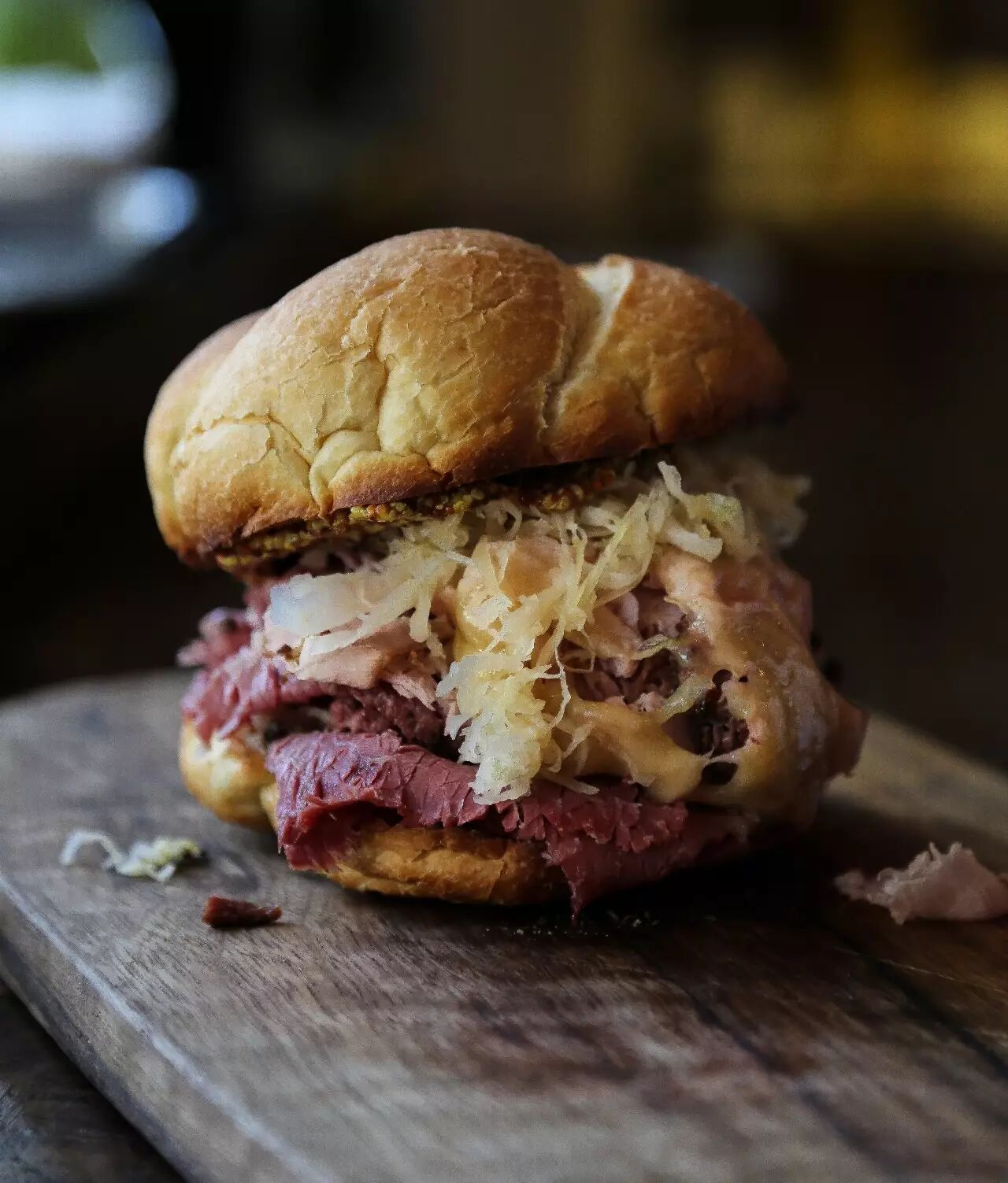 pastrami, coleslaw, cheddar, and mustard served on a kaiser roll