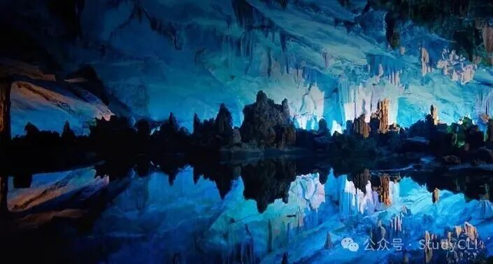 A view of rock formations illuminated with blue light in Seven Star Cave, Guilin