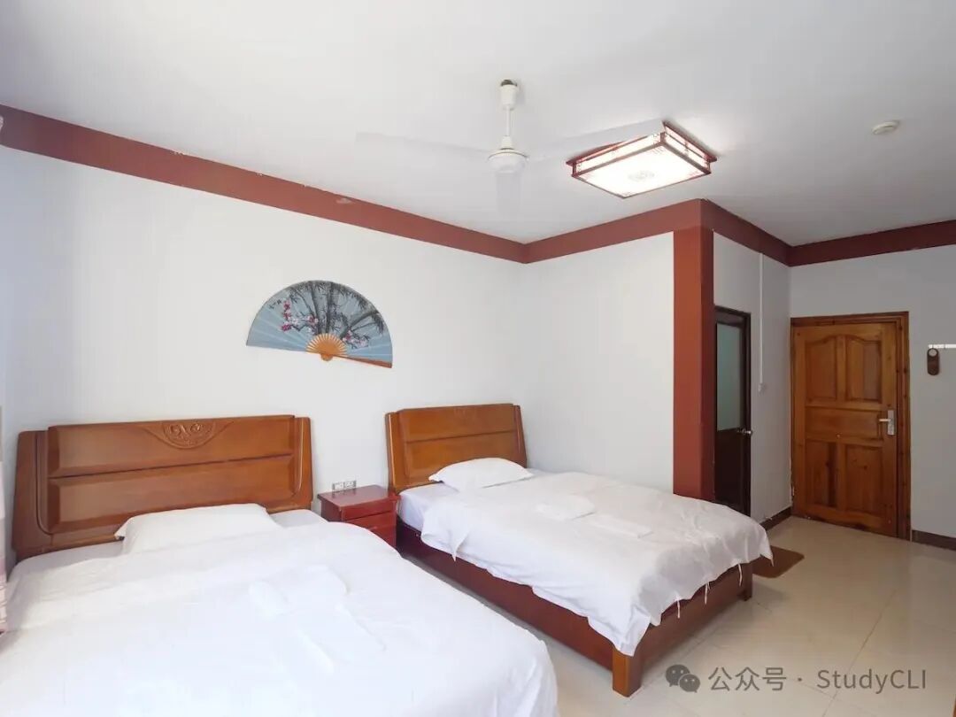 Private student room at the CLI Center in Guilin with rebuilt bathroom and new door