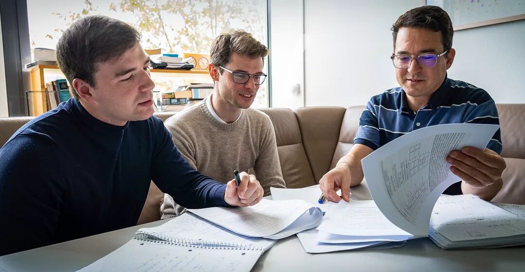 Lukas Brenner, Libor Caha, and Robert König all sit around a table