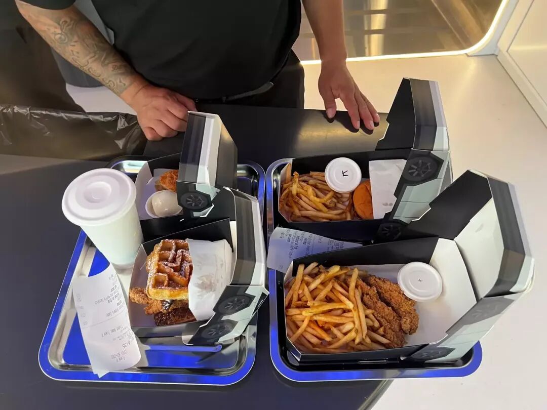 Elon Musk's new Tesla diner has robot waiters and 'Epic Bacon' on the menu