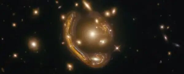 令人驚嘆的“愛因斯坦環”揭示了94億光年外的星系的圖1