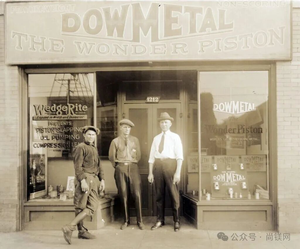 Black and white photo of three men in front of a store