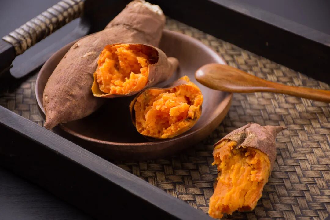 Roasted sweet potatoes from a metal barrel oven