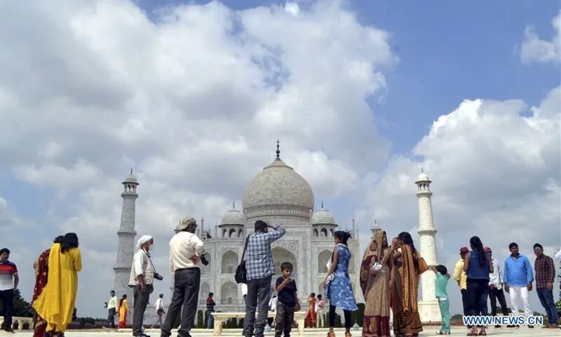 People visit the Taj Mahal in Agra, India, Sept. 23, 2020. India's iconic monument of love - Taj Mahal, which was closed on March 17 amid the COVID-19 pandemic, was reopened Monday to tourists, officials said. (Str/Xinhua)