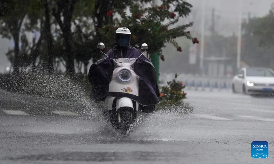 A citizen rides amid heavy rainfall in Beihai, South China's Guangxi Zhuang Autonomous Region on June 14, 2025. Multiple Chinese authorities convened on Saturday to put in place precautionary measures against Typhoon Wutip, the first typhoon of the year, which is expected to bring heavy rainfall to the southern parts of the country. Photo: Xinhua