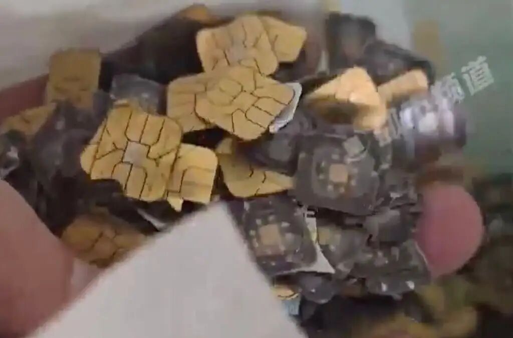 Scrap SIM cards, above, play a central role in the gold extraction process. Photo: Weibo