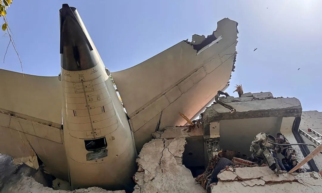 Handout picture taken and released by the Indian Central Industrial Security Force on June 12, 2025 shows the back of an Air India plane after it crashed in a residential area near the airport in Ahmedabad. The London-bound flight crashed on June 12 in India's western city of Ahmedabad with 242 on board. Photo: AFP