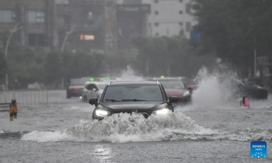 Vehicles drive through a flooded area in Haikou, south China's Hainan Province, July 20, 2025. Typhoon Wipha, the sixth typhoon of the year, made landfall near Jiangmen City in south China's Guangdong Province around 5:50 pm on Sunday, according to the Guangdong provincial meteorological observatory. Photo: Xinhua