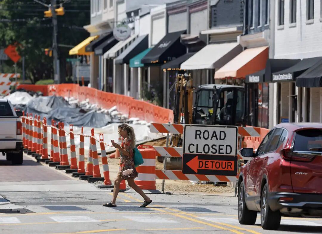 A pedestrian crosses Salem Street on Thursday, Sept. 3 as construction was underway in downtown Apex.