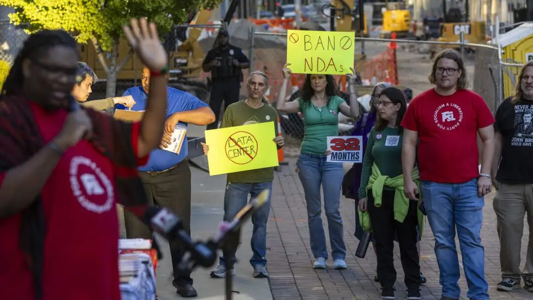 Demonstrators protest outside the Raleigh Municipal Building before a Raleigh City Council meeting Tuesday, Oct. 6, 2026, calling on the council to approve a moratorium on data center development in Raleigh. The council held a public hearing on a proposed six-month moratorium following objections to a proposed data center project on Jones Sausage Road and calls for a longer pause.