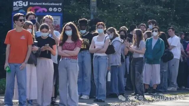 Students queuing to receive vaccines and antibiotics at the University of Kent campus in Canterbury