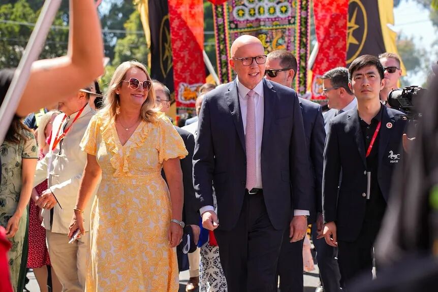 Peter and Kirilly Dutton walk in a Lunar New Year parade in melbourne