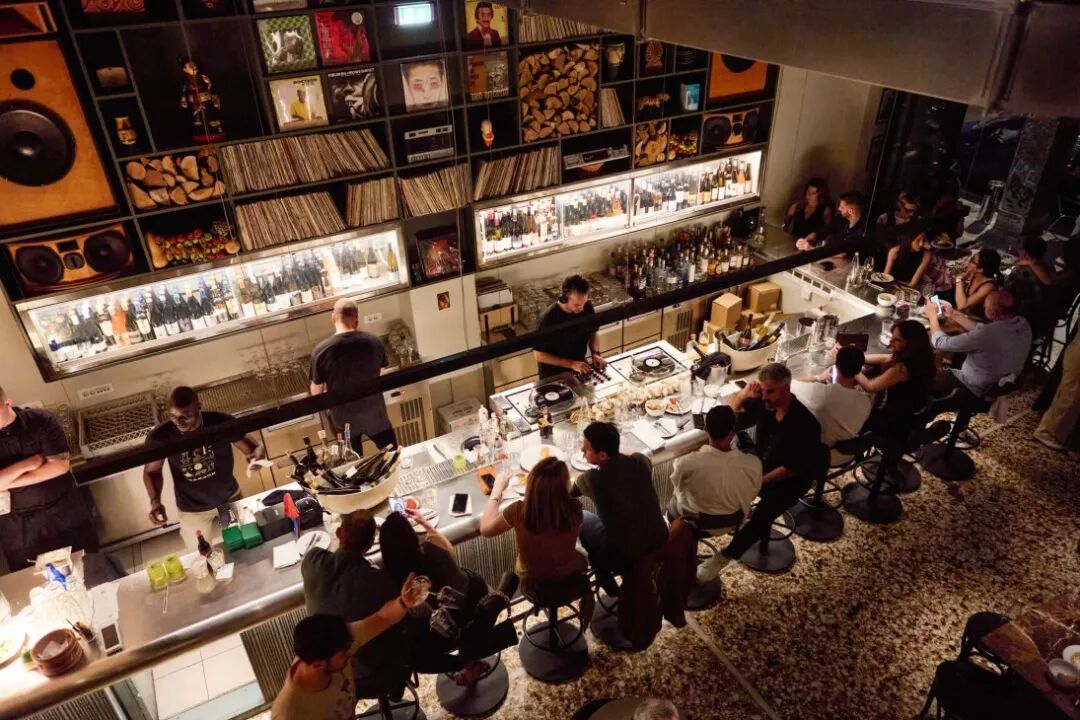 DJ decks on a bar with food and drinks in Athens