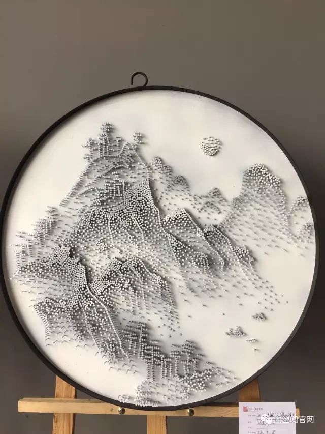 钉子制作的雪山雕塑