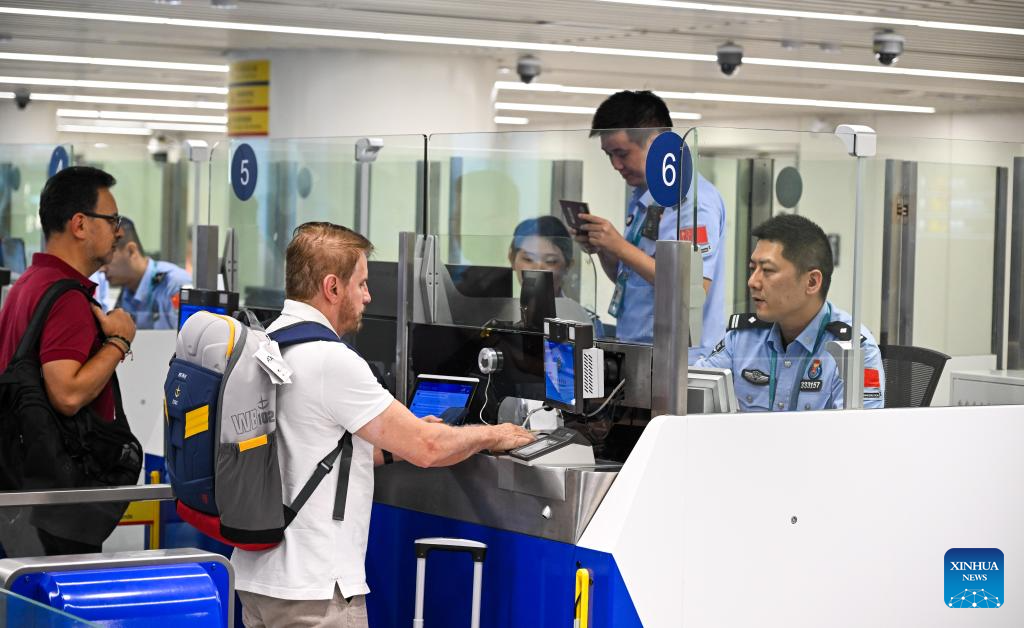 Inbound passengers go through border inspection procedures at Haikou Meilan International Airport in Haikou, south China's Hainan Province, Oct. 15, 2025. Hainan has handled 2 million inbound and outbound trips crossing the border this year as of Oct. 15, with foreign travelers accounting for 53 percent of the total, according to the Haikou General Station of Immigration Inspection.  Hainan has long enjoyed favorable visa-free entry policies in China. The majority of foreigners who enter Hainan do so under the visa-free entry policy. (Xinhua/Yang Guanyu)