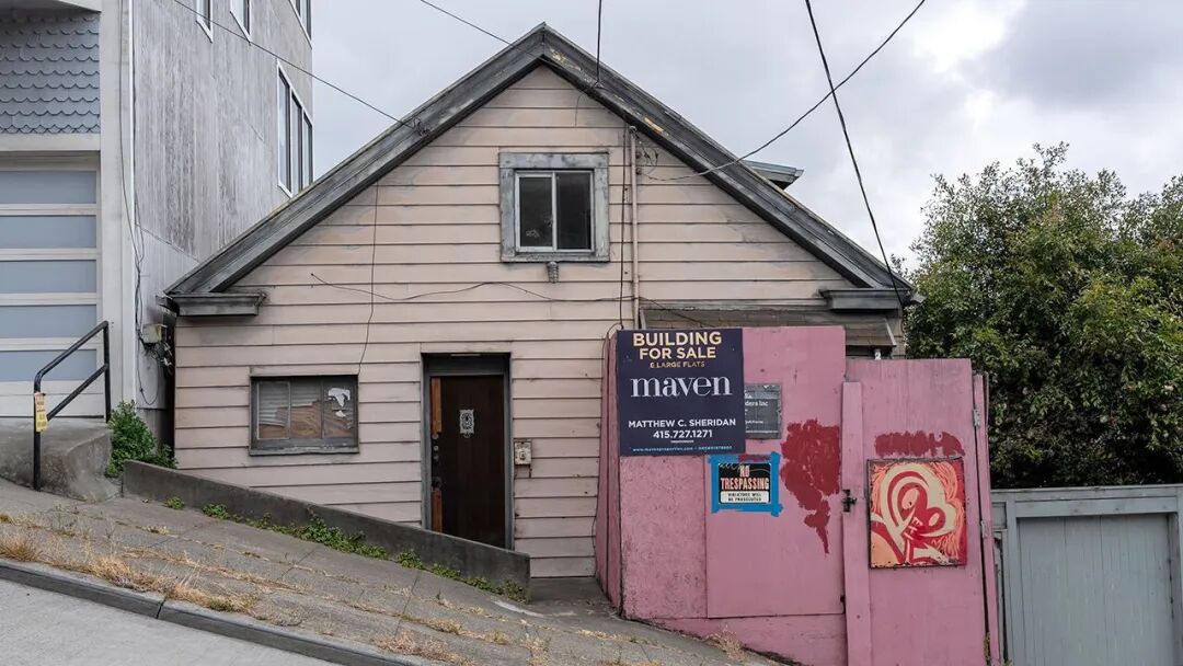 A "Building For Sale" sign on a home in San Francisco, California