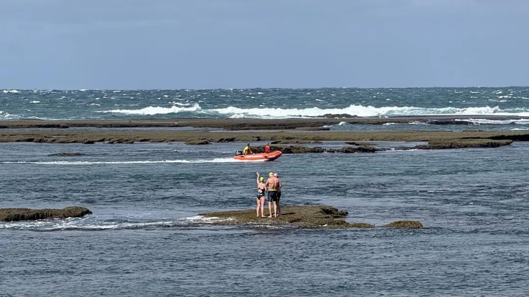 Distressed Point Lonsdale locals watch on as emergency responders rush to the aid of swimmers and kayakers caught in a rip on Saturday afternoon.