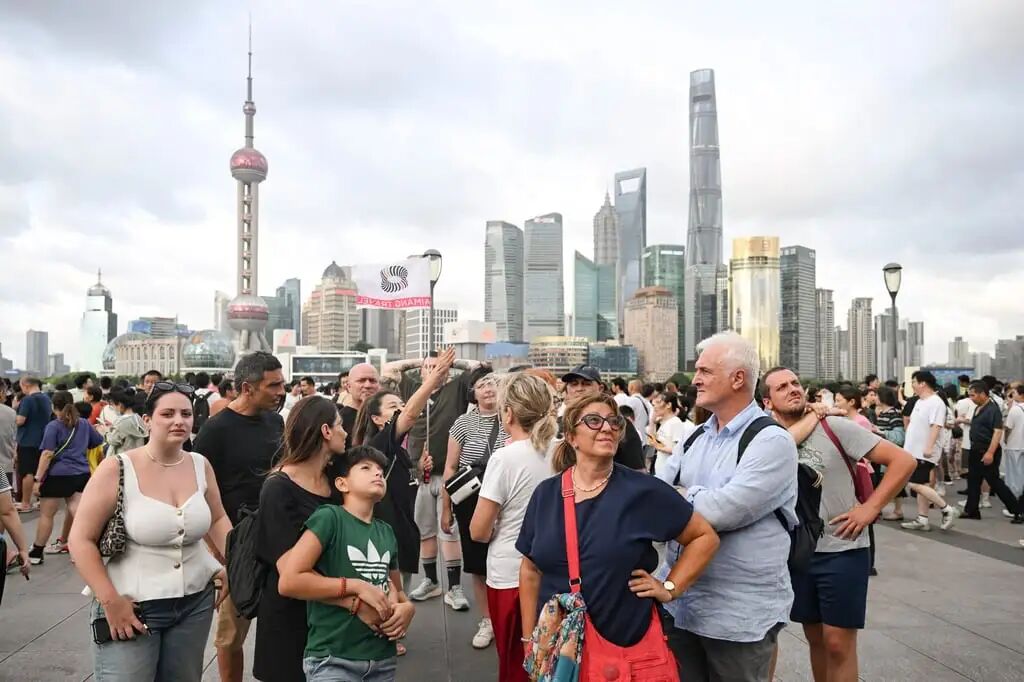 Tourists from Italy visit Shanghai's Bund area. The city is home to some of the country's top hospitals. Photo: Xinhua