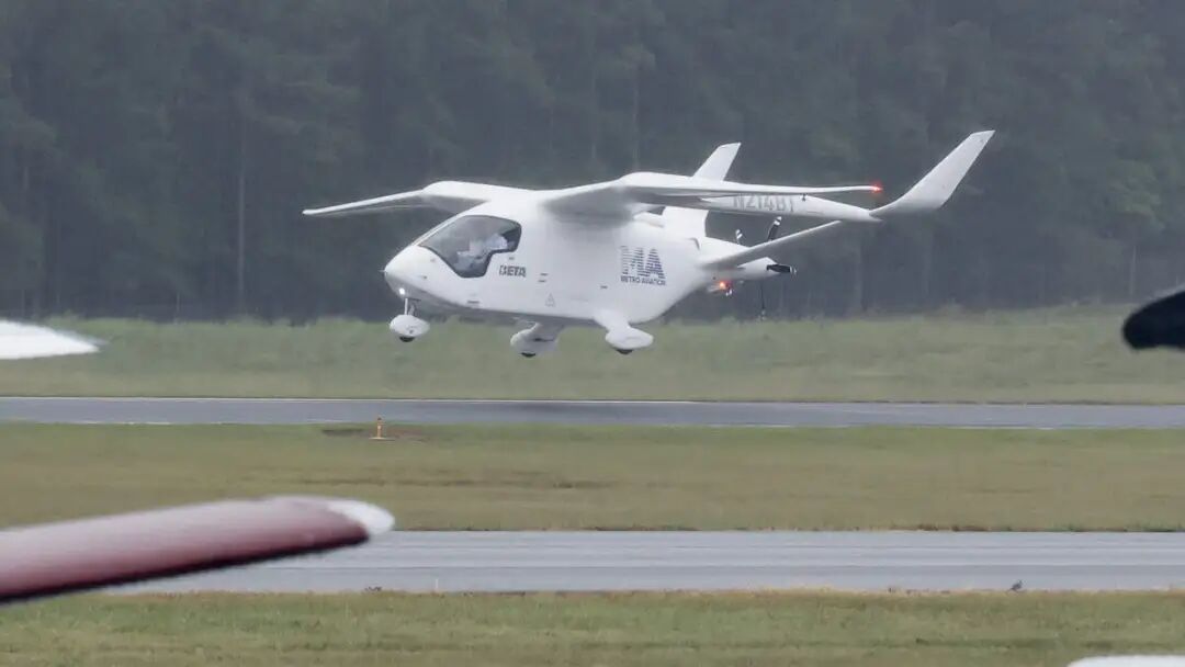 A Beta Technologies ALIA all-electric aircraft lands at the Raleigh Executive Jetport in Sanford on Wednesday with BETA Technologies founder and CEO Kyle Clark piloting and N.C. Gov. Josh Stein as a passenger.