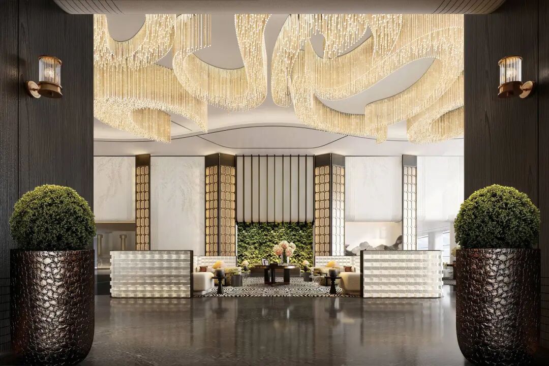 大堂内两侧有时尚沙发，圆桌上有黄色花朵