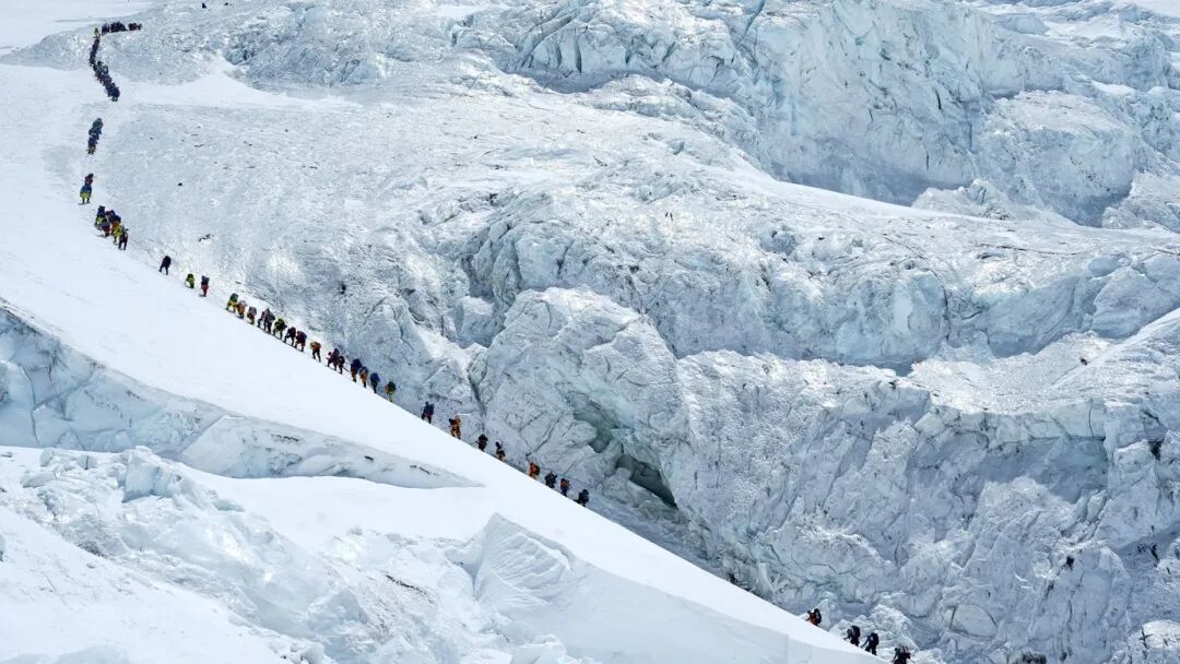 Climbers walk in a long queue as they head to the summit of Mount Everest, Nepal, on Monday.