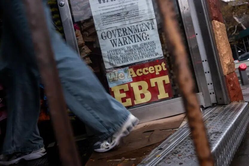A store displays a sign accepting Electronic Benefits Transfer (EBT) cards for Supplemental Nutrition Assistance Program (SNAP) purchases for groceries on October 30, 2025 in New York City.
