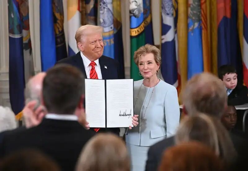 WASHINGTON, DC - MARCH 20: U.S. President Donald Trump holding up a signed executive order poses with U.S. Education Secretary Linda McMahon at the White House on March 20, 2025 in Washington, DC. Trump on March 20 signed an executive order to formally begin the process of dismantling the Education Department, saying that his administration is returning education back to the states. (Photo by Chen Mengtong/China News Service/VCG via Getty Images)